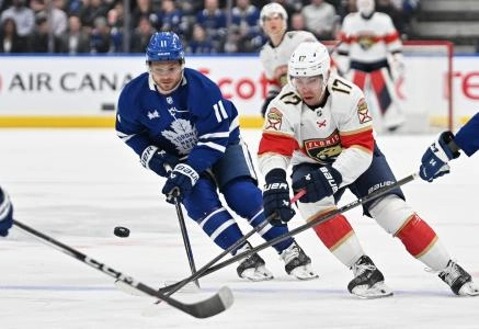 Toronto Maple Leafs forward Max Domi engaged in a battle against Florida Panthers forward Evan Rodrigues. Toronto Maple Leafs forward Max Domi engaged in a battle against Florida Panthers forward Evan Rodrigues.