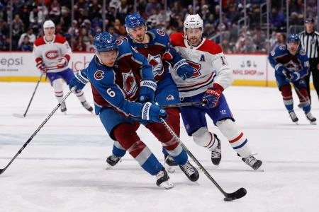 Dec 21, 2022; Denver, Colorado, USA; Colorado Avalanche defenseman Erik Johnson (6) controls the puck as defenseman Samuel Girard (49) defends against Montreal Canadiens right wing Josh Anderson (17) in the third period at Ball Arena. Mandatory Credit: Isaiah J. Downing-Imagn Images Dec 21, 2022; Denver, Colorado, USA; Colorado Avalanche defenseman Erik Johnson (6) controls the puck as defenseman Samuel Girard (49) defends against Montreal Canadiens right wing Josh Anderson (17) in the third period at Ball Arena. Mandatory Credit: Isaiah J. Downing-Imagn Images