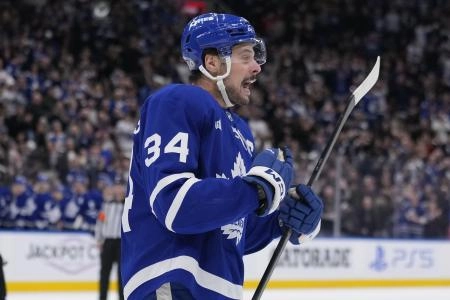 Jan 4, 2025; Toronto, Ontario, CAN; Toronto Maple Leafs forward Auston Matthews (34) reacts after a goal by forward Matthew Knies (not pictured) during the third period against the Boston Bruins at Scotiabank Arena. Mandatory Credit: John E. Sokolowski-Imagn Images