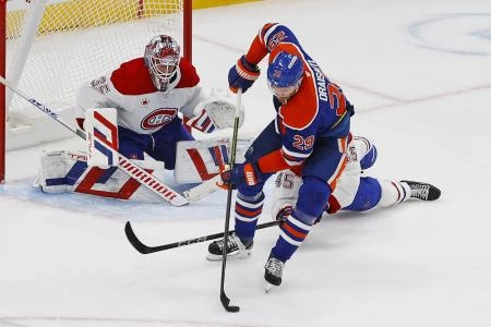 Mar 6, 2025; Edmonton, Alberta, CAN; Edmonton Oilers forward Leon Draisaitl (29) tries to get a shot away on Montreal Canadiens goaltender Sam Montembeault (35) during overtime at Rogers Place. Mandatory Credit: Perry Nelson-Imagn Images Mar 6, 2025; Edmonton, Alberta, CAN; Edmonton Oilers forward Leon Draisaitl (29) tries to get a shot away on Montreal Canadiens goaltender Sam Montembeault (35) during overtime at Rogers Place. Mandatory Credit: Perry Nelson-Imagn Images