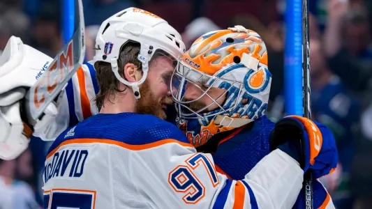 Edmonton Oilers' Connor McDavid hugs goalie Stuart Skinner after a win
