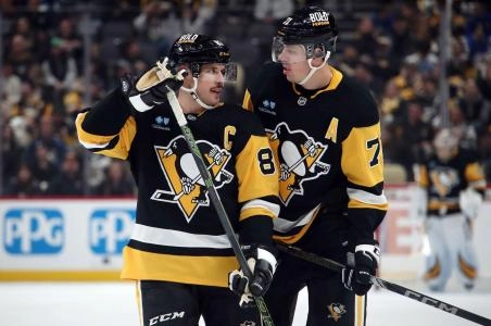 Pittsburgh Penguins forward Evgeni Malkin standing next to captain Sidney Crosby