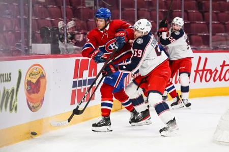 Jan 30, 2022; Montreal, Quebec, CAN; Columbus Blue Jackets right wing Yegor Chinakhov (59) checks Montreal Canadiens center Jake Evans (71) during the first period at Bell Centre. Mandatory Credit: David Kirouac-Imagn Images Jan 30, 2022; Montreal, Quebec, CAN; Columbus Blue Jackets right wing Yegor Chinakhov (59) checks Montreal Canadiens center Jake Evans (71) during the first period at Bell Centre. Mandatory Credit: David Kirouac-Imagn Images