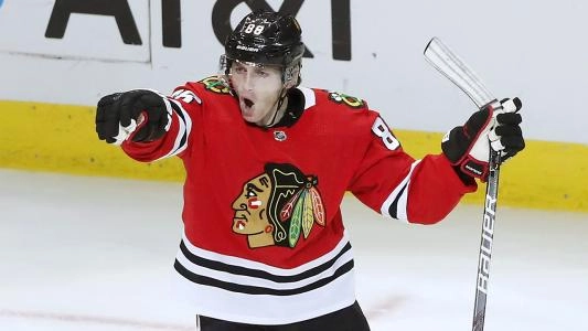 Chicago Blackhawks' Patrick Kane celebrates a goal by pointing to a teammate Chicago Blackhawks' Patrick Kane celebrates a goal by pointing to a teammate
