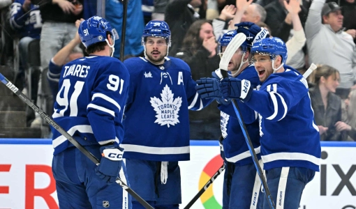 Apr 11, 2024; Toronto, Ontario, CAN; Toronto Maple Leafs forward John Tavares (91) celebrates with forwards Max Domi (11) and Auston Matthews (34) and defenseman Morgan Rielly (44) after scoring against the New Jersey Devils in the third period at Scotiabank Arena. Mandatory Credit: Dan Hamilton-Imagn Images