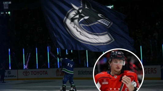 Vancouver Canucks mascot waving the flag with former first round pick Jakub Vrana Vancouver Canucks mascot waving the flag with former first round pick Jakub Vrana