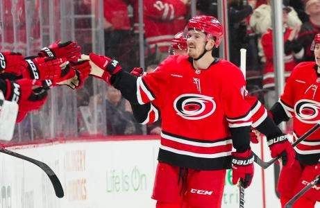 Mar 14, 2025; Raleigh, North Carolina, USA; Carolina Hurricanes center Jack Roslovic (96) celebrates his goal against the Detroit Red Wings during the second period at Lenovo Center. Mandatory Credit: James Guillory-Imagn Images Mar 14, 2025; Raleigh, North Carolina, USA; Carolina Hurricanes center Jack Roslovic (96) celebrates his goal against the Detroit Red Wings during the second period at Lenovo Center. Mandatory Credit: James Guillory-Imagn Images