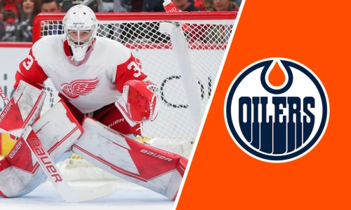 Goaltender Sebastian Cossa in action with Red Wings, Oilers Logo