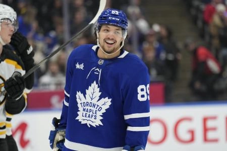 Jan 4, 2025; Toronto, Ontario, CAN; Toronto Maple Leafs forward Nicholas Robertson (89) smiles during a break in the action against the Boston Bruins in the first period at Scotiabank Arena. Mandatory Credit: John E. Sokolowski-Imagn Images