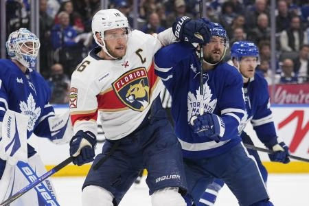 May 18, 2025; Toronto, Ontario, CAN; Florida Panthers forward Aleksander Barkov (16) and Toronto Maple Leafs defenceman Chris Tanev (8) battle for position during the second period of game seven of the second round of the 2025 Stanley Cup Playoffs at Scotiabank Arena. Mandatory Credit: John E. Sokolowski-Imagn Images May 18, 2025; Toronto, Ontario, CAN; Florida Panthers forward Aleksander Barkov (16) and Toronto Maple Leafs defenceman Chris Tanev (8) battle for position during the second period of game seven of the second round of the 2025 Stanley Cup Playoffs at Scotiabank Arena. Mandatory Credit: John E. Sokolowski-Imagn Images