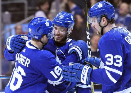 Nov 24, 2018; Toronto, Ontario, CAN; Toronto Maple Leafs forward Josh Leivo (32) celebrates with forwards Mitchell Marner (16) and Frederik Gauthier (33) after scoring against Philadelphia Flyers in the second period at Scotiabank Arena. Mandatory Credit: Dan Hamilton-Imagn Images
