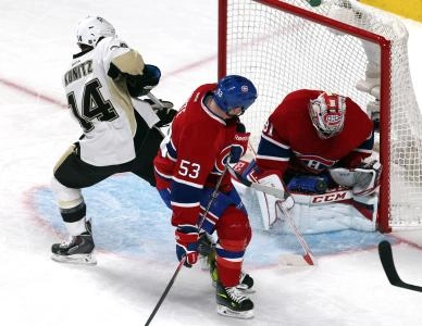 Nov 23, 2013; Montreal, Quebec, CAN; Montreal Canadiens goalie Carey Price (31) makes a save on Pittsburgh Penguins left wing Chris Kunitz (14) as center Ryan White (53) defends during the first period at Bell Centre. Mandatory Credit: Jean-Yves Ahern-Imagn Images Nov 23, 2013; Montreal, Quebec, CAN; Montreal Canadiens goalie Carey Price (31) makes a save on Pittsburgh Penguins left wing Chris Kunitz (14) as center Ryan White (53) defends during the first period at Bell Centre. Mandatory Credit: Jean-Yves Ahern-Imagn Images