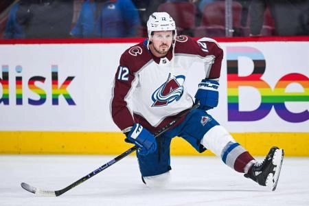 Jan 15, 2024; Montreal, Quebec, CAN; Colorado Avalanche center Ryan Johansen (12) stretches on the ice during warm-up before the game against the Montreal Canadiens at Bell Centre.