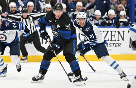 Toronto Maple Leafs forward John Tavares being pressured by Winnipeg Jets forward Kyle Connor. Toronto Maple Leafs forward John Tavares being pressured by Winnipeg Jets forward Kyle Connor.