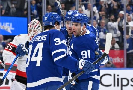 Apr 22, 2025; Toronto, Ontario, CAN; Toronto Maple Leafs forward John Tavares (91) celebrates with forwards Auston Matthews (34) and Matthew Knies (23) after scoring a goal against the Ottawa Senators in the first period in game two of the first round of the 2025 Stanley Cup Playoffs at Scotiabank Arena