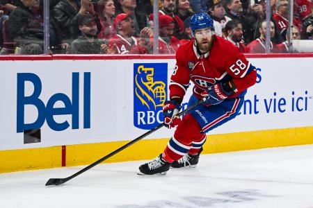 Apr 14, 2025; Montreal, Quebec, CAN; Montreal Canadiens defenseman David Savard (58) plays the puck near the boards against the Chicago Blackhawks in the first period at Bell Centre. Mandatory Credit: David Kirouac-Imagn Images