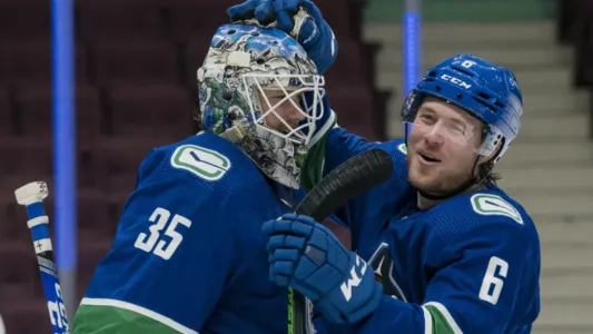 Vancouver Canucks stars Thatcher Demko (left) and Brock Boeser (right).