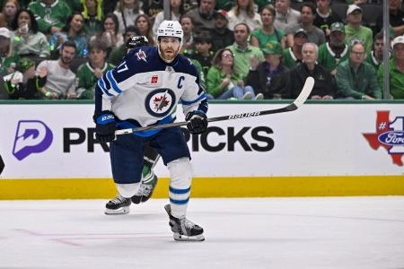 May 11, 2025; Dallas, Texas, USA; Winnipeg Jets center Adam Lowry (17) in action during the game between the Dallas Stars and the Winnipeg Jets in game three of the second round of the 2025 Stanley Cup Playoffs at American Airlines Center. Mandatory Credit: Jerome Miron-Imagn Images