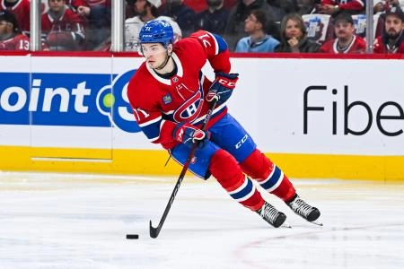 Apr 27, 2025; Montreal, Quebec, CAN; Montreal Canadiens center Jake Evans (71) plays the puck against the Washington Capitals during the second period in game four of the first round of the 2025 Stanley Cup Playoffs at Bell Centre. Mandatory Credit: David Kirouac-Imagn Images