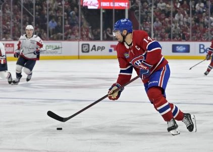Apr 25, 2025; Montreal, Quebec, CAN; Montreal Canadiens forward Nick Suzuki (14) plays the puck during the second period in game three of the first round of the 2025 Stanley Cup Playoffs against the Washington Capitals at the Bell Centre. Mandatory Credit: Eric Bolte-Imagn Images Apr 25, 2025; Montreal, Quebec, CAN; Montreal Canadiens forward Nick Suzuki (14) plays the puck during the second period in game three of the first round of the 2025 Stanley Cup Playoffs against the Washington Capitals at the Bell Centre. Mandatory Credit: Eric Bolte-Imagn Images