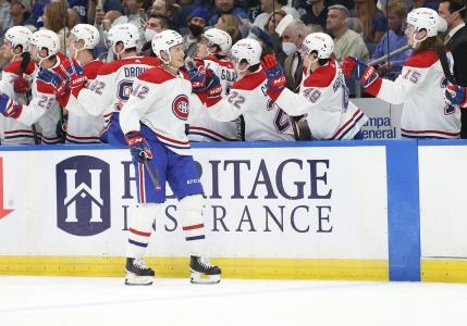 Dec 28, 2021; Tampa, Florida, USA; Montreal Canadiens center Lukas Vejdemo (42) is congratulated as he scores a goal against the Tampa Bay Lightning during the first period at Amalie Arena. Mandatory Credit: Kim Klement-Imagn Images