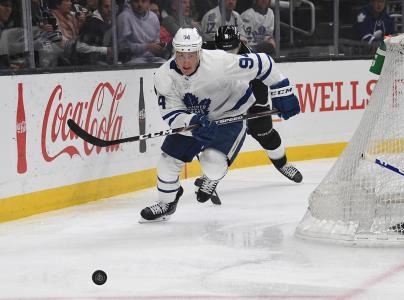 Tyson Barrie chases a loose puck