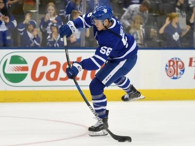 Sep 19, 2017; Toronto, Ontario, CAN; Toronto Maple Leafs defenceman Andrew Nielsen (58) takes a shot during warmup prior to playing Ottawa Senators at Air Canada Centre. Mandatory Credit: Dan Hamilton-Imagn Images