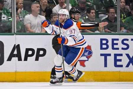 May 29, 2025; Dallas, Texas, USA; Edmonton Oilers center Connor McDavid (97) celebrates scoring a breakaway goal during the game between the Dallas Stars and the Edmonton Oilers in game five of the Western Conference Final of the 2025 Stanley Cup Playoffs at American Airlines Center. Mandatory Credit: Jerome Miron-Imagn Images