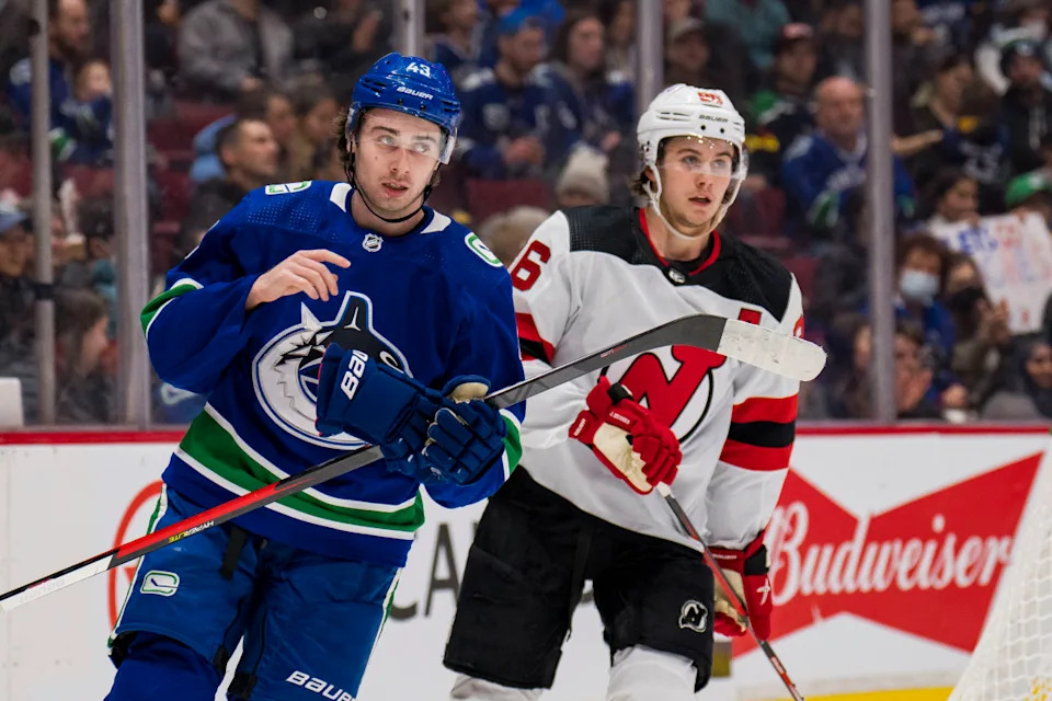 <em>Vancouver Canucks defenseman Quinn Hughes (43) shares laugh with his brother New Jersey Devils forward Jack Hughes (86) in the second period at Rogers Arena.</em><strong>Bob Frid-USA TODAY Sports</strong>