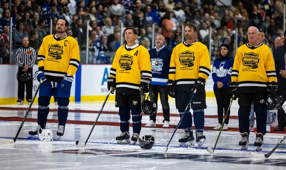  From left, Maple Leafs’ Auston Matthews, Brampton Mayor Patrick Brown, Toronto Maple Leafs alumni Curtis Joseph and Canadian sports commentator Ron MacLean stand during the playing of the Canadian national anthem before the start of Hockey Night in Brampton in support of local charities at the CAA Centre in Brampton on Wednesday, Aug. 20, 2025. ERNEST DOROSZUK/TORONTO SUN