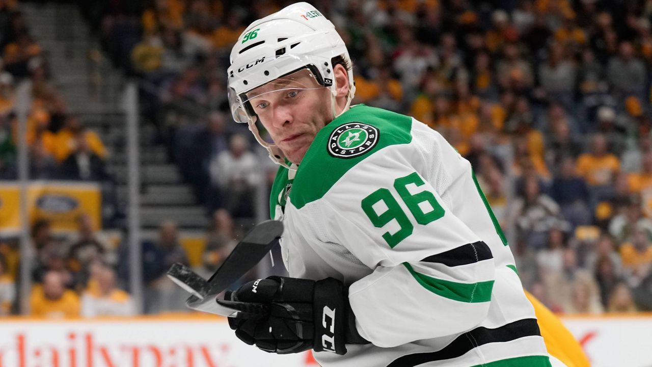 Dallas Stars right wing Mikko Rantanen (96) chases the puck during the first period of an NHL hockey game against the Nashville Predators, Wednesday, April 16, 2025, in Nashville, Tenn. (AP Photo/George Walker IV)