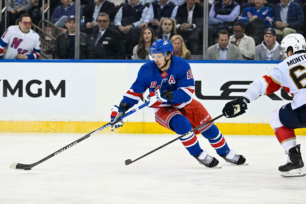 New York Rangers left wing Artemi Panarin (10) skates with the puck as Florida Panthers defenseman Brandon Montour (62) defends during the third period in game five of the Eastern Conference Final of the 2024 Stanley Cup Playoffs at Madison Square Garden.