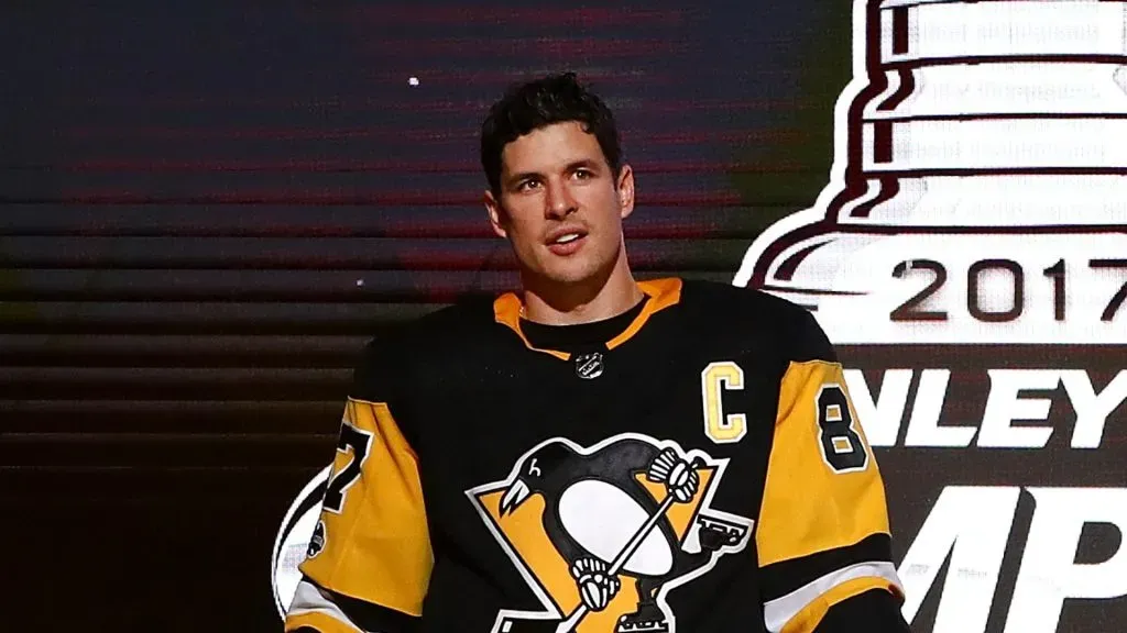 Sidney Crosby #87 of the Pittsburgh Penguins brings the Stanley Cup to the ice before to raising their 2017 championship banner prior to playing the St. Louis Blues at PPG PAINTS Arena on October 4, 2017 in Pittsburgh, Pennsylvania.