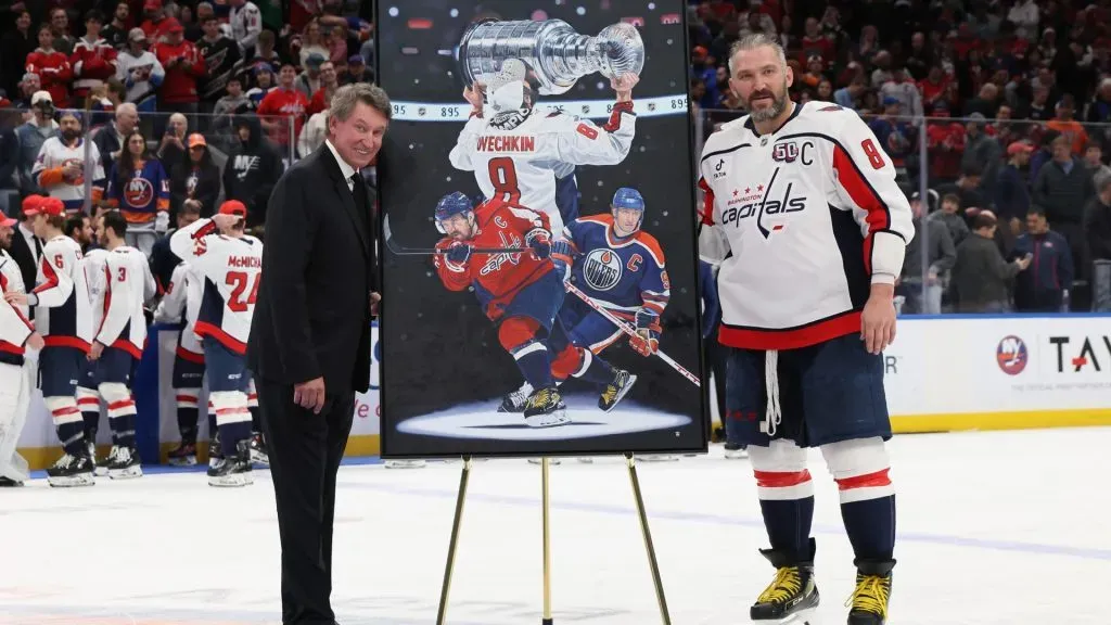 Alex Ovechkin #8 and Wayne Gretzky celebrate Ovechkin’s record-breaking 895th NHL career goal against the New York Islanders at UBS Arena on April 06, 2025 in Elmont, New York. (Photo by Bruce Bennett/Getty Images)