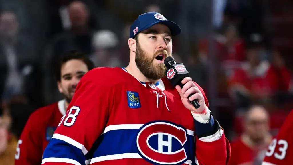 David Savard #58 of the Montreal Canadiens addresses the fans after a 4-2 victory against the Carolina Hurricanes clinching the last spot in the Eastern Conference playoffs at the Bell Centre on April 16, 2025 in Montreal, Quebec, Canada.