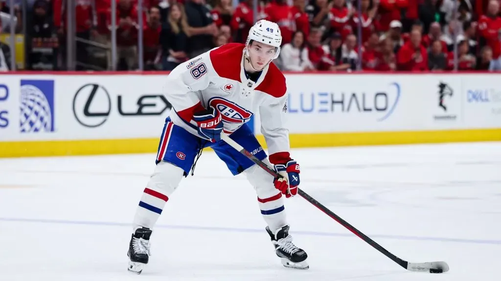 Lane Hutson #48 of the Montreal Canadiens handles the puck against the Washington Capitals during the third period in Game Five of the First Round of the 2025 Stanley Cup Playoffs at Capital One Arena on April 30, 2025 in Washington, DC. (Photo by Scott Taetsch/Getty Images)