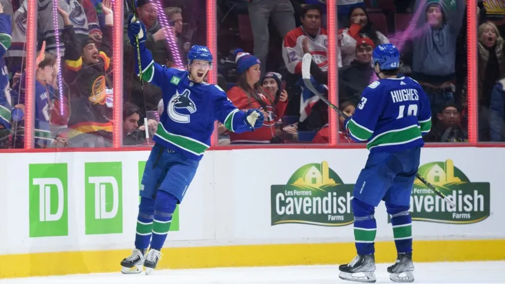 Elias Pettersson #40 celebrates with Quinn Hughes #43 of the Vancouver Canucks after scoring a goal in overtime against the Montréal Canadiens during their NHL game at Rogers Arena on December 5, 2022 in Vancouver, British Columbia, Canada. (Photo by Derek Cain/Getty Images)