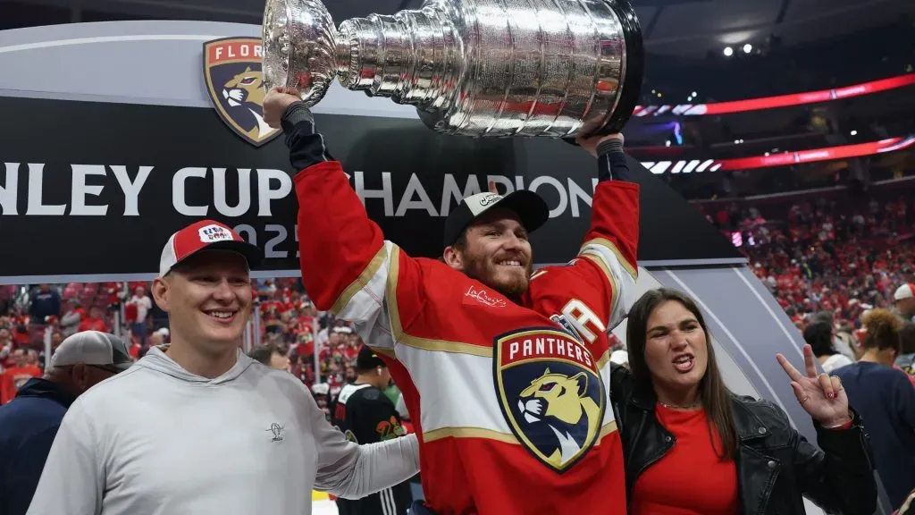 Matthew Tkachuk #19 of the Florida Panthers poses with brother Brady and the Stanley Cup. (Photo by Christian Petersen/Getty Images)