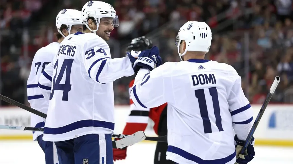 Auston Matthews #34 of the Maple Leafs celebrates his goal with teammate Max Domi. (Photo by Elsa/Getty Images)