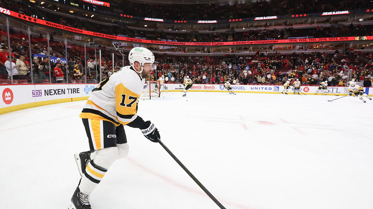 Pittsburgh Penguins right wing Bryan Rust (17) warms up before a game against the Chicago Blackhawks at United Center. 