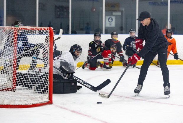 Former Blackhawks right wing Patrick Kane scores a goal on a youth goalie during Patrick Kane Day Friday, Aug. 8, 2025 at Johnny's Ice House West in the United Center neighborhood of Chicago. The City of Chicago officially named Aug. 8 Patrick Kane Day. Kane donated multiple items to the youth that attended the skate around including hockey sticks, helmets, gloves and more.(Dominic Di Palermo/Chicago Tribune)