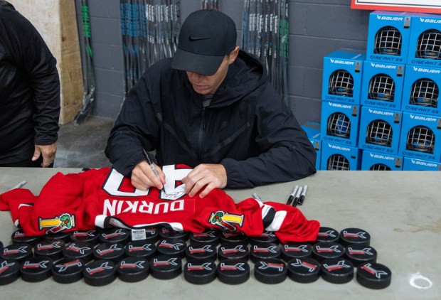 Former Blackhawks right wing Patrick Kane signs an autograph on a youth hockey player's jersey during Patrick Kane Day Friday, Aug. 8, 2025 at Johnny's Ice House West in the United Center neighborhood of Chicago. The City of Chicago officially named Aug. 8 Patrick Kane Day. Kane donated multiple items to the youth that attended the skate around including hockey sticks, helmets, gloves and more.(Dominic Di Palermo/Chicago Tribune)