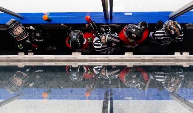 Youth hockey players wait to skate around with former Blackhawks right wing Patrick Kane during Patrick Kane Day Friday, Aug. 8, 2025, at Johnny's Ice House West in the United Center neighborhood of Chicago. The City of Chicago officially named Aug. 8 Patrick Kane Day. Kane donated multiple items to the youth that attended the skate around including hockey sticks, helmets, gloves and more.(Dominic Di Palermo/Chicago Tribune)