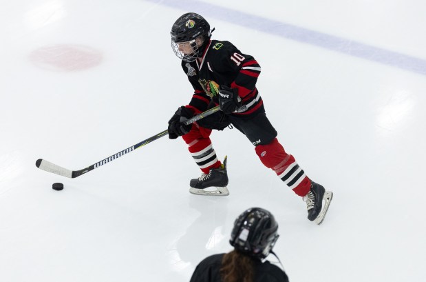 Cain Slager, 11, skates around with a puck during Patrick Kane Day Friday, Aug. 8, 2025 at Johnny's Ice House West in the United Center neighborhood of Chicago. The City of Chicago officially named Aug. 8 Patrick Kane Day. Kane donated multiple items to the youth that attended the skate around including hockey sticks, helmets, gloves and more.(Dominic Di Palermo/Chicago Tribune)