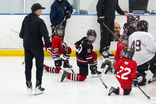 Former Blackhawks right wing Patrick Kane, left, skates around with youth hockey players during Patrick Kane Day Friday, Aug. 8, 2025 at Johnny's Ice House West in the United Center neighborhood of Chicago. The City of Chicago officially named Aug. 8 Patrick Kane Day. Kane donated multiple items to the youth that attended the skate around including hockey sticks, helmets, gloves and more.(Dominic Di Palermo/Chicago Tribune)