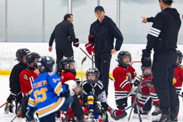 Former Blackhawks right wing Patrick Kane, center, skates around with youth hockey players during Patrick Kane Day Friday, Aug. 8, 2025 at Johnny's Ice House West in the United Center neighborhood of Chicago. The City of Chicago officially named Aug. 8 Patrick Kane Day. Kane donated multiple items to the youth that attended the skate around including hockey sticks, helmets, gloves and more.(Dominic Di Palermo/Chicago Tribune)