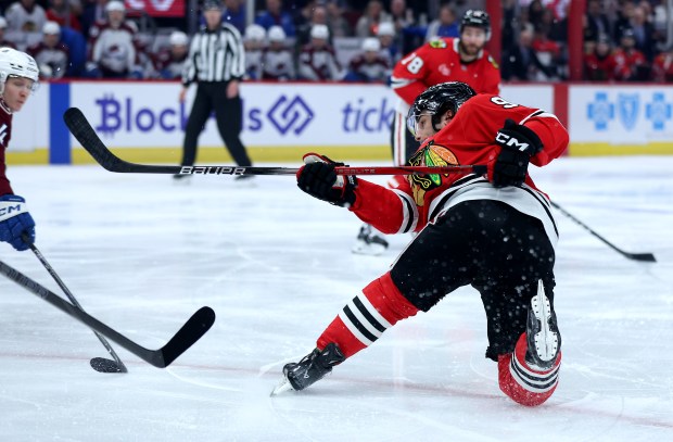 Chicago Blackhawks center Frank Nazar (91) loses his balance as he shoots the puck in the first period of a game against the Colorado Avalanche at the United Center in Chicago on Jan. 8, 2025. (Chris Sweda/Chicago Tribune)