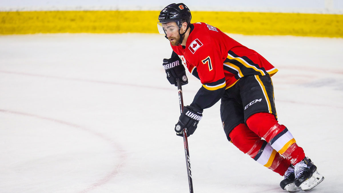 Calgary Flames defenseman TJ Brodie (7) skates with the puck against the Vegas Golden Knights during the second period at Scotiabank Saddledome.