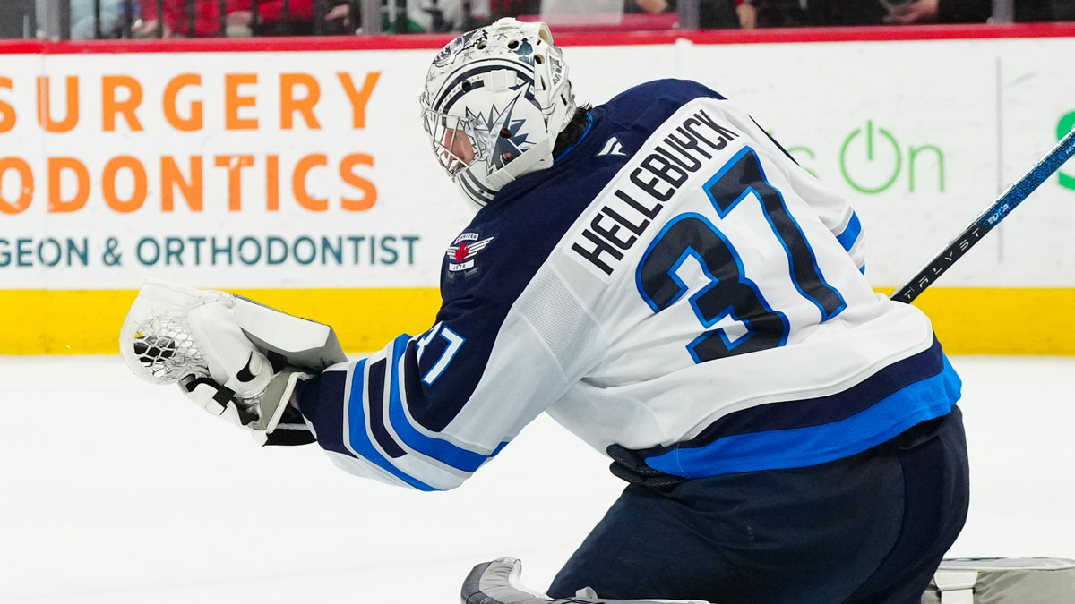 Winnipeg Jets goaltender Connor Hellebuyck (37) makes a glove save against the Carolina Hurricanes during the third period at Lenovo Center.