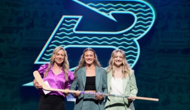 Haley Winn, center, posed for a photo after the Boston Fleet selected her during the first round of the PWHL draft.